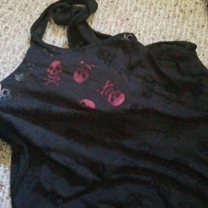 Black tank with see thru skulls.